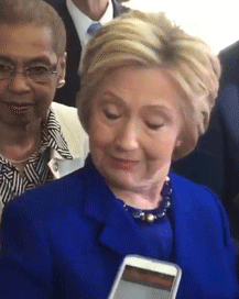 Hillary Clinton squinting and tilting her head in visible confusion.